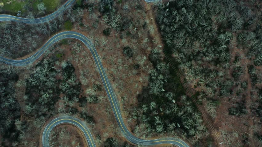 Twisting mountain roads through dense forests in Chimney Rock State Park, North Carolina