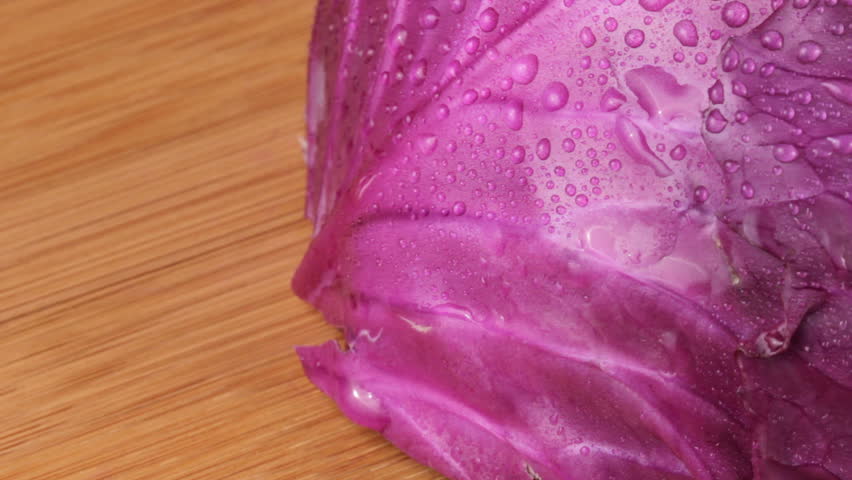 Close up HD video of slicing a red cabbage