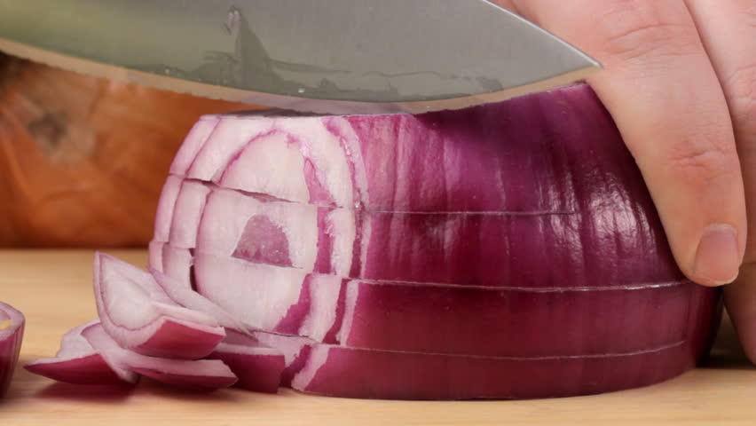 Cutting a red onion, shot in HD video