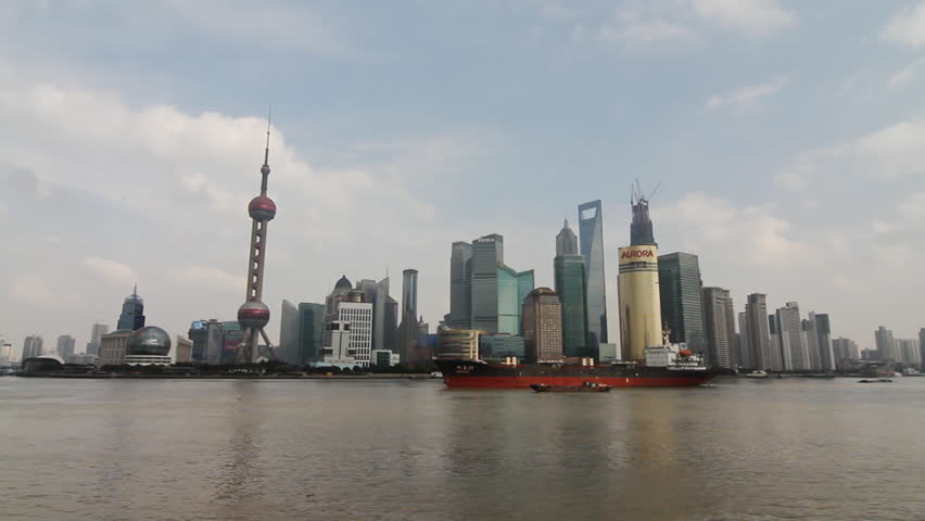 SHANGHAI - DECEMBER 19: Cargo ship and container ship passing in the Huangpu