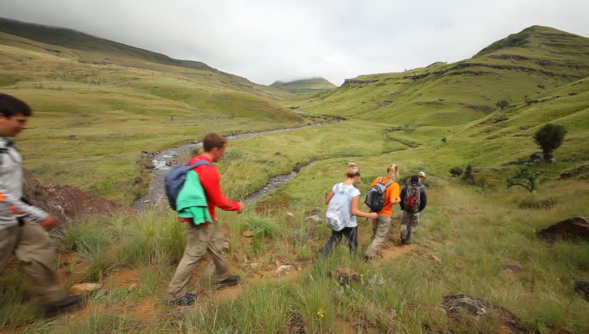 Young group hiking in the Drakensberg,  the highest mountain range in Southern