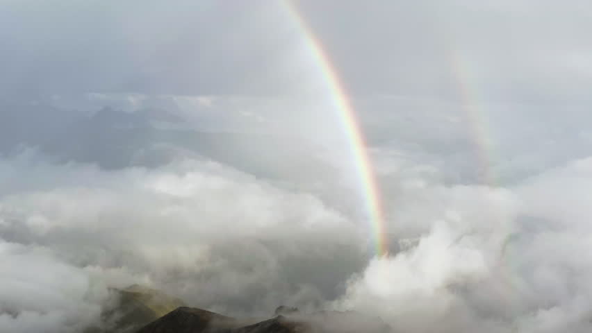 Fantastic rainbow in the Gergeti Glacier area, Stepantsminda, Kazbegi, Georgia.