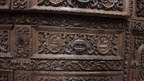 A wooden chest with a lot of carvings on it. The carvings are of different shapes and sizes, and they seem to be of various animals. The chest is old and has a lot of detail - Powered by Shutterstock - Get 15% off with code: PIKWIZARD15