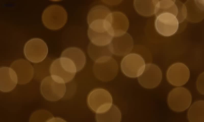 Abstract bokeh lights background with orange yellow and blue glow