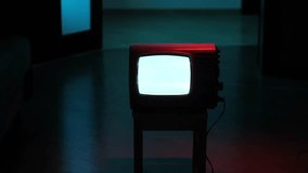 Old analog television showing white static noise in dark room - Powered by Shutterstock - Get 15% off with code: PIKWIZARD15