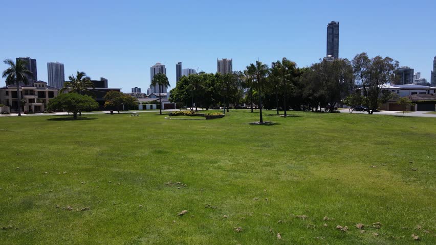 Aerial view of the iconic Gold Coast towering urban skyline looking over the intersecting canal waterways. Creative drone view