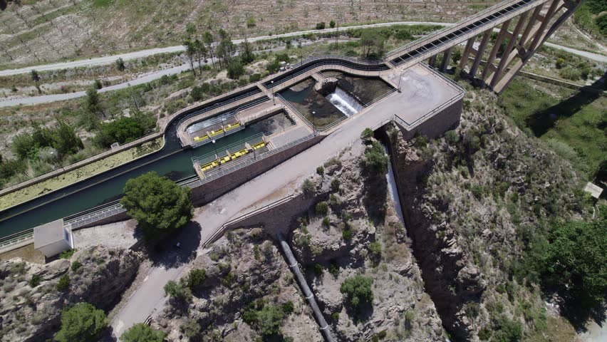 Water management. Weirs water management. Modern aqueduct and irrigation water distribution pipes. Open channel weirs. Aerial view. Partidor de Cañizares.Granada.Spain.