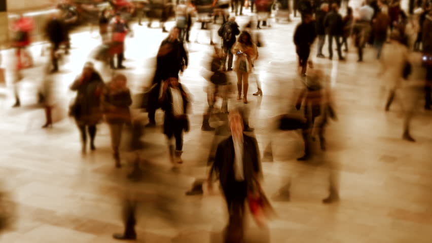 Blurred figures in fast motion show the energetic city life of a modern metropolis