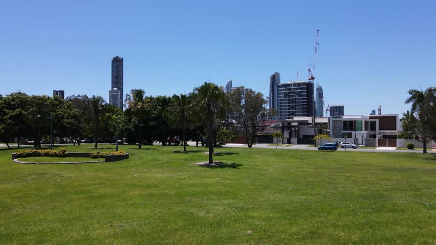 Towering buildings of Surfers Paradise and Broadbeach overlooking the Gold Coast real estate hot spot suburbs of Chevron Island. Creative drone view