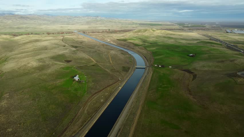 USA, CA, Newman, , 2024-12-28 - Drone view of the California Central Valley with I-5 on the right and an aquaduct on the left