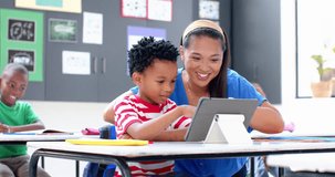 In school, teacher and student using tablet together in classroom, smiling. Education, technology, learning, digital, teaching, interacting, unaltered, slow motion - Powered by Shutterstock - Get 15% off with code: PIKWIZARD15