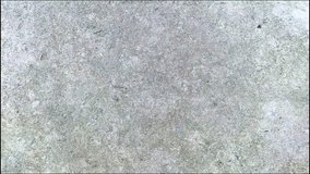 Concrete or cement surface with a rough texture and gray color. This video is interesting because it can provide an optical illusion that makes the surface appear to have a certain depth or pattern. - Powered by Shutterstock - Get 15% off with code: PIKWIZARD15