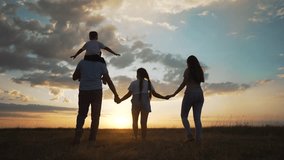 Happy family traveling in park at sunset. Parents lifting child in air. Joyful family bonding in park. Concept park travel adventure. Scenic family moments outdoors. Family enjoying travel in park. - Powered by Shutterstock - Get 15% off with code: PIKWIZARD15