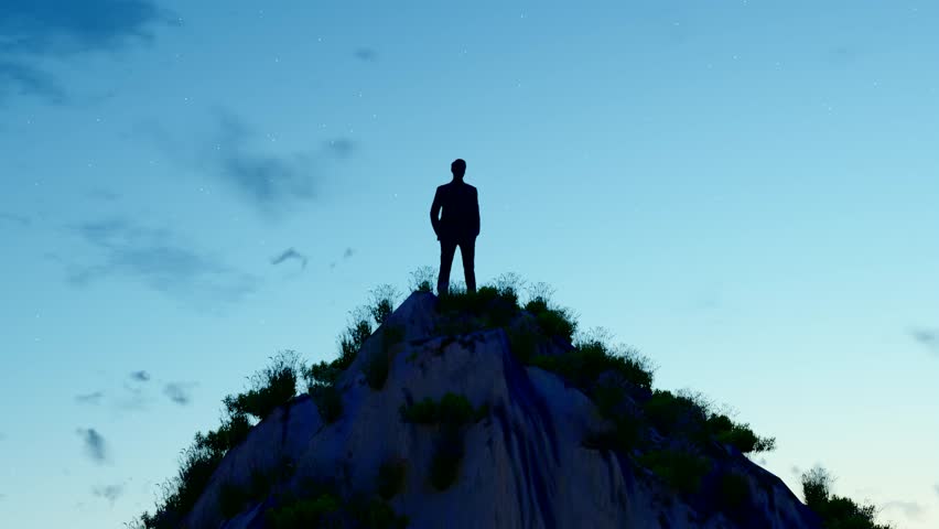 Back view of a man looking up at the starry sky and the future on the top of a mountain at night