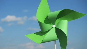 renewable energy concept vertical video. green paper pinwheel in hands against blue sky. World Environment Day. Recycling symbol. circular economy concept for environmental sustainability  - Powered by Shutterstock - Get 15% off with code: PIKWIZARD15