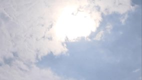 Rising sunburst and fast clouds on blue sky time lapse - Powered by Shutterstock - Get 15% off with code: PIKWIZARD15