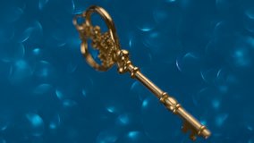 Beautiful decorative golden key rotates on a blurred background. Closeup. Macro - Powered by Shutterstock - Get 15% off with code: PIKWIZARD15