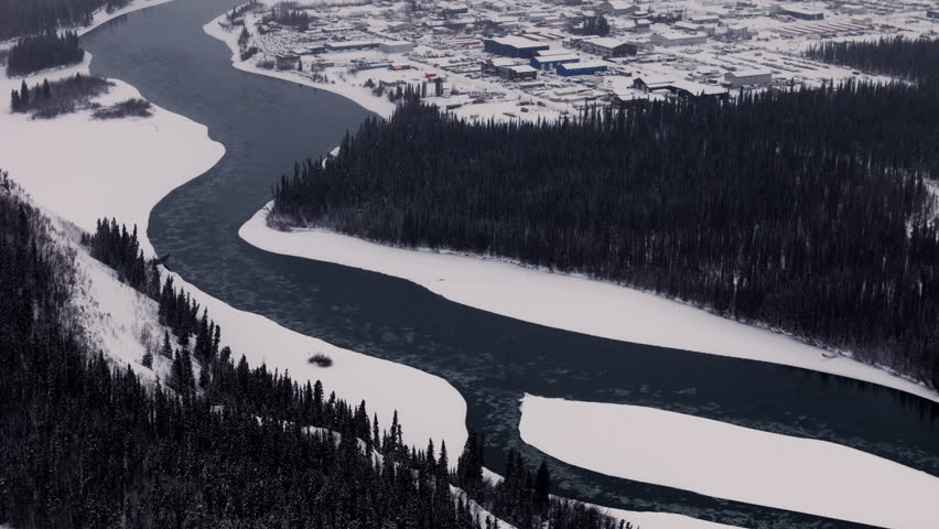 Flowing River Near Whitehorse Town At Winter Season In Yukon Territory, Canada. Aerial Drone shot