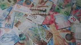 Swiss Francs In Close-Up Of Different Denominations, With The Inscription Schweiz Franken - Powered by Shutterstock - Get 15% off with code: PIKWIZARD15