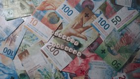 Swiss Francs In Close-Up Of Different Denominations, With The Inscription Schweiz Franken - Powered by Shutterstock - Get 15% off with code: PIKWIZARD15