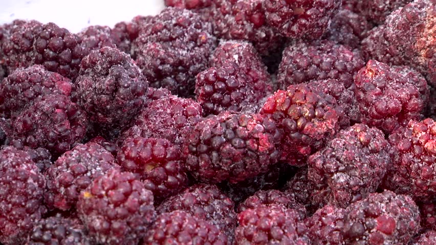Frozen blackberries in a box. Close-up.