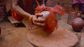 Indian woman painting ceramic pot at Dharavi, Mumbai, India,  - Powered by Shutterstock - Get 15% off with code: PIKWIZARD15