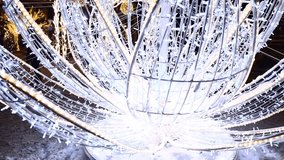 A large white sculpture lit up by numerous lights. - Powered by Shutterstock - Get 15% off with code: PIKWIZARD15