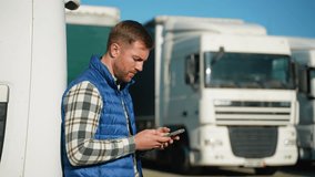 Truck driver using smartphone outdoors - Powered by Shutterstock - Get 15% off with code: PIKWIZARD15