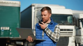 Truck driver coordinating logistics using laptop and radio - Powered by Shutterstock - Get 15% off with code: PIKWIZARD15
