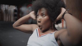 African American model athlete training in the gym sweating happy fighting training with weights skipping rope - Powered by Shutterstock - Get 15% off with code: PIKWIZARD15