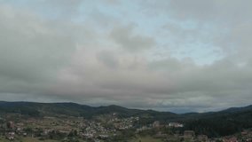 Aerial View Of Majestic Mountains And Dense Forest Under Dark Storm Clouds. A Vibrant Rainbow Appears After The Rain As The Drone Flies Through Misty Clouds, Revealing Stunning Nature. - Powered by Shutterstock - Get 15% off with code: PIKWIZARD15