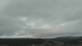 Aerial View Of Majestic Mountains And Lush Forest Under Dark Clouds. A Stunning Rainbow Appears After The Rain As The Drone Soars Through Misty Clouds, Revealing A Breathtaking Scene. - Powered by Shutterstock - Get 15% off with code: PIKWIZARD15