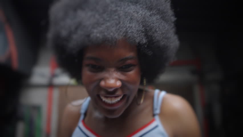 African American model athlete training in the gym sweating happy fighting training with weights skipping rope - Powered by Shutterstock - Get 15% off with code: PIKWIZARD15