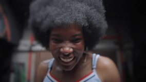 African American model athlete training in the gym sweating happy fighting training with weights skipping rope - Powered by Shutterstock - Get 15% off with code: PIKWIZARD15