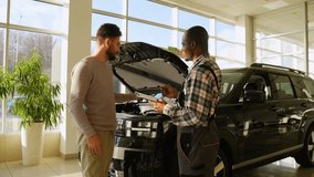 Mechanic discussing car repair details with customer and shaking hands - Powered by Shutterstock - Get 15% off with code: PIKWIZARD15