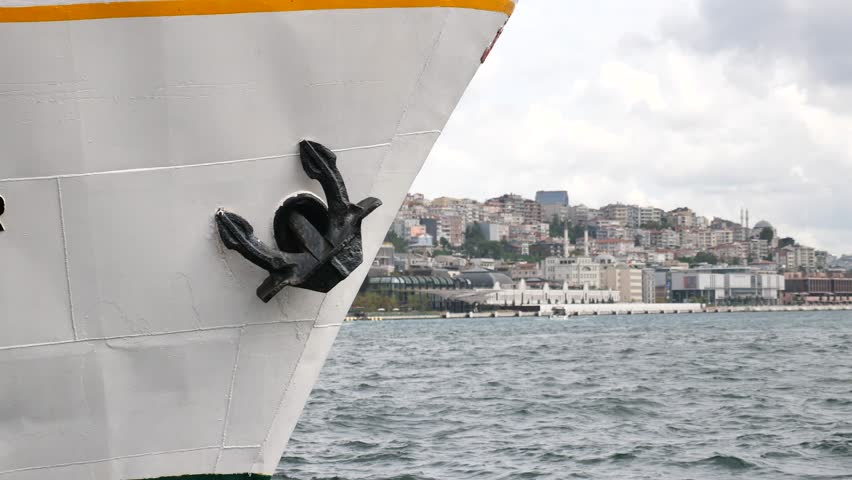 A breathtaking harbor view showcasing a ships bow and a sturdy anchor in calm waters,