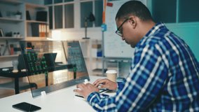 Male programmer troubleshoots bugs in a program on a futuristic computer screen - Powered by Shutterstock - Get 15% off with code: PIKWIZARD15