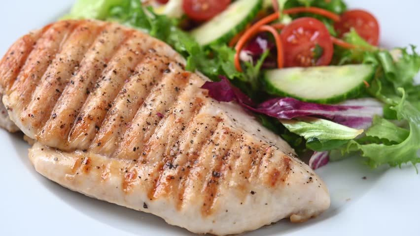  Healthy grilled chicken with salad on white plate