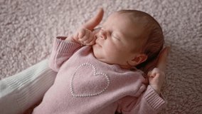 Caring Mother Holding In Hands Her Adorable Infant Baby Girl Wearing In Pink Clothes - Powered by Shutterstock - Get 15% off with code: PIKWIZARD15