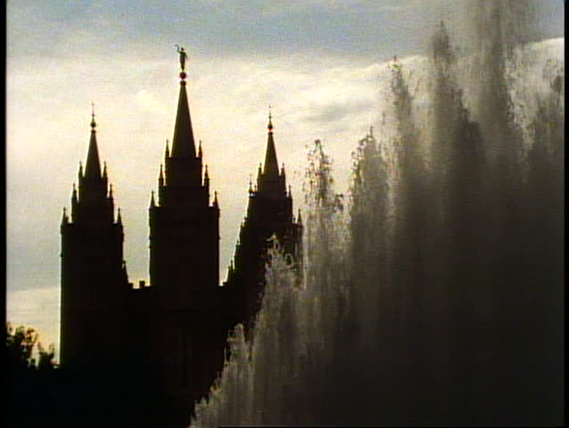 The Mormon Temple of Salt Lake City, Utah, spires against large fountain