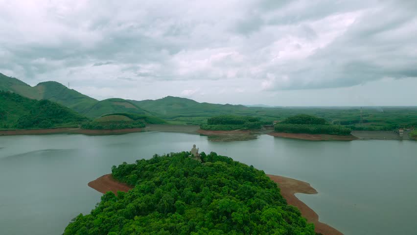 Aerial view from top of the mountains with lake and tropical rainforest in Vietnam