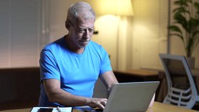 Senior businessman working at home on his laptop, experiencing stress, headache, fatigue, and disappointment, showing various negative emotions - Powered by Shutterstock - Get 15% off with code: PIKWIZARD15