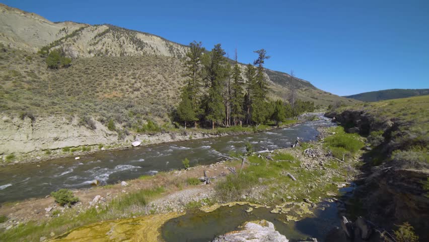 View of the Lewis River as it flows from Lewis Lake and joins the Snake River.