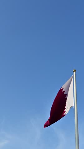 waving qatar flag on sky background