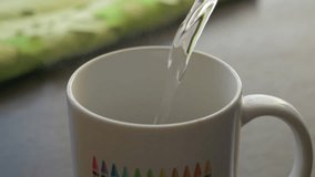 Fresh Morning Pour Over Coffee Close Up. Slow Motion. Milk Chocolate In White Cup. Pouring Hot Water From Kettle to Make Coffee Closeup. Pouring Hot Water Into White Cup Chocolate. - Powered by Shutterstock - Get 15% off with code: PIKWIZARD15