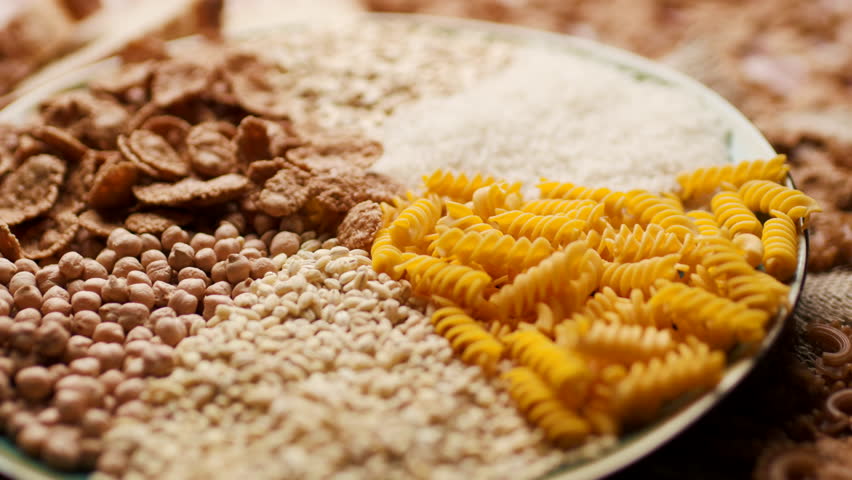 Carbohydrate-rich foods, including bread, rice, wholegrain flakes, oats, wheat and corn pasta. Carbs Food.