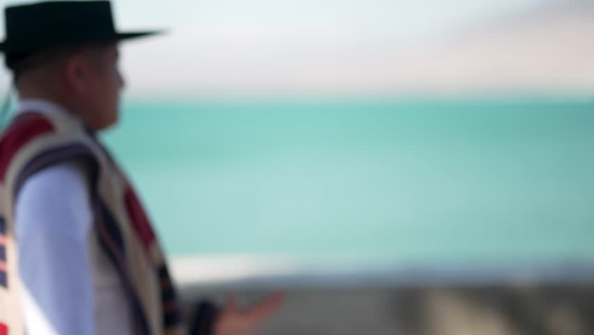 Traditional chilean cueca dance performed by a couple wearing typical costumes