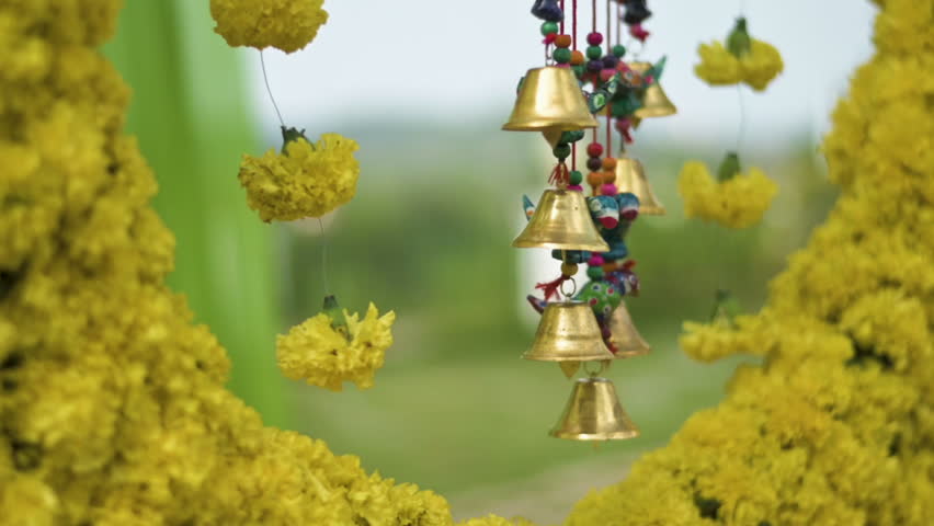 Close-up shot of Decorations for the Haldi ritual, a pre-wedding ceremony common at traditional Indian weddings. Slow motion.