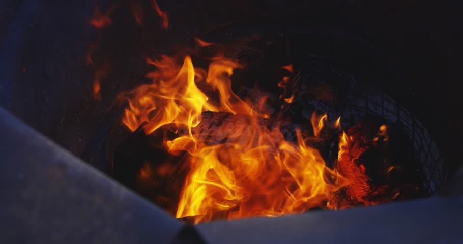 A slow motion of burning flame in the bonfire stand