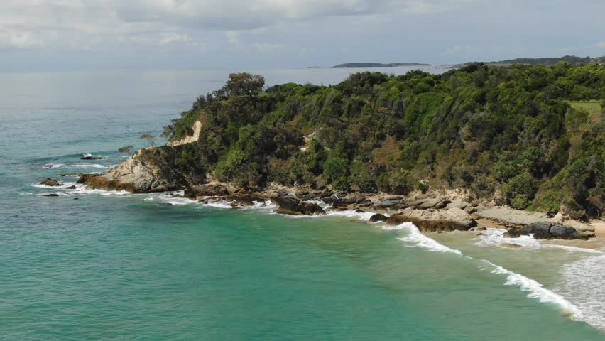 White Bluff Lookout, viewpoint over Sapphire Beach, New South Wales in Australia. Aerial forward